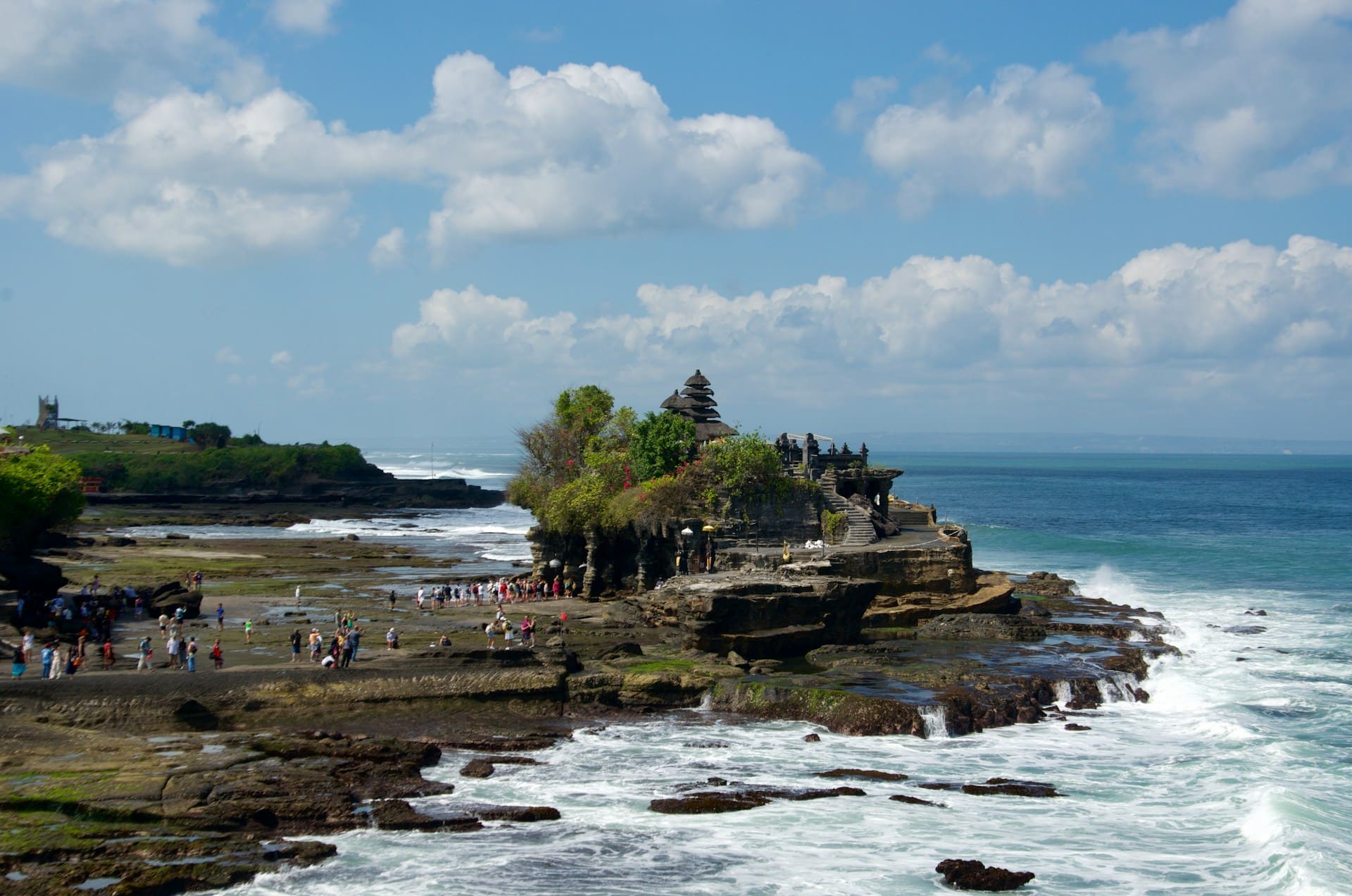 The iconic Tanah Lot sea temple at sunset, a highlight of a cultural Bali Spiritual Trip with Bali 99 Tour.