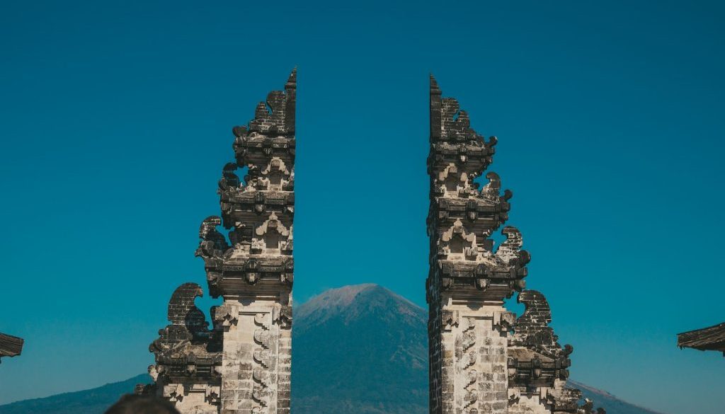 Peaceful Balinese temple gate at sunrise representing a tranquil Bali Spiritual Trip experience.