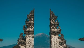 Peaceful Balinese temple gate at sunrise representing a tranquil Bali Spiritual Trip experience.