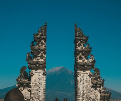 Peaceful Balinese temple gate at sunrise representing a tranquil Bali Spiritual Trip experience.